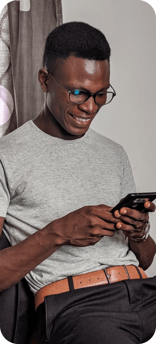 Man with glasses using his phone