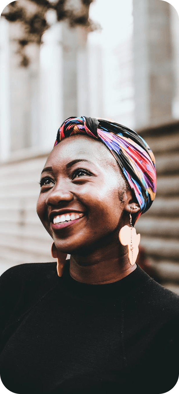 Smiling woman wearing a colourful headwrap